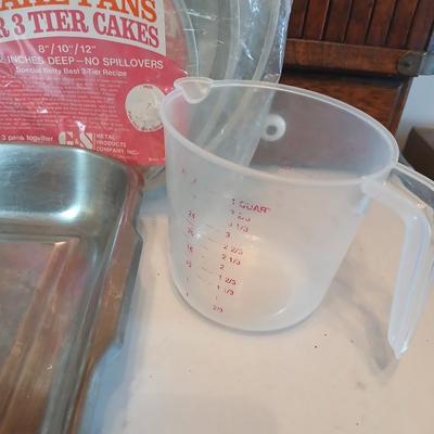 Bake ware = New Best Party pack 3 cake pan - 3 tiered cakes - Foly muffin tins - New Oneida 8" square cake pan and a large cake pan