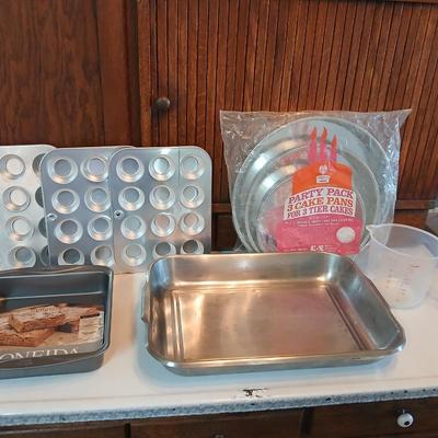 Bake ware = New Best Party pack 3 cake pan - 3 tiered cakes - Foly muffin tins - New Oneida 8" square cake pan and a large cake pan
