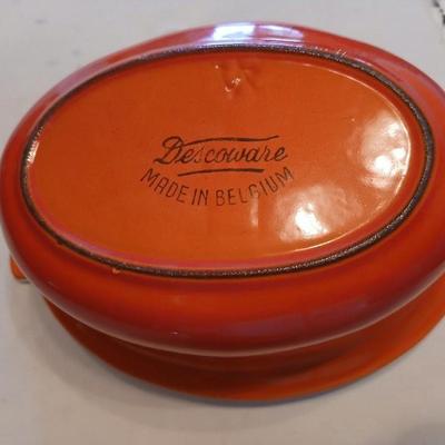 Vintage Le Creuset heritage-style Decoware mini dutch oven or casserole dish in the signature Flame Orange color.