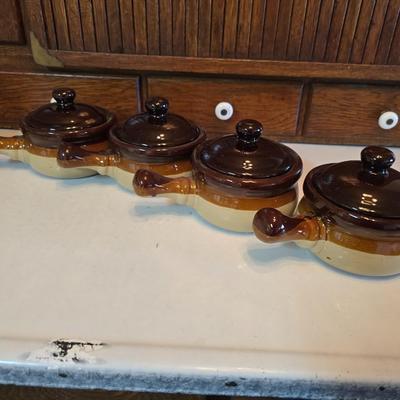 ceramic French onion soup bowls / lidded crocks, and a matching double salt and pepper shaker set.
