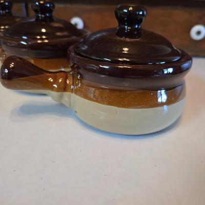 ceramic French onion soup bowls / lidded crocks, and a matching double salt and pepper shaker set.