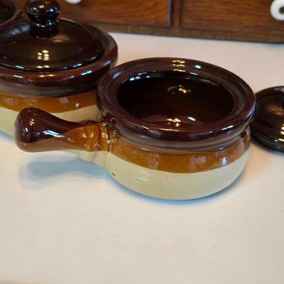 ceramic French onion soup bowls / lidded crocks, and a matching double salt and pepper shaker set.