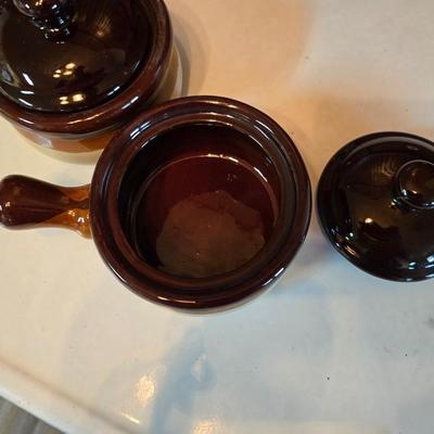 ceramic French onion soup bowls / lidded crocks, and a matching double salt and pepper shaker set.