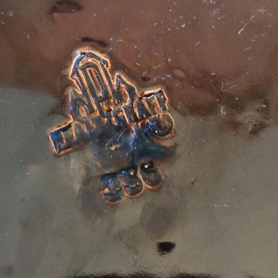 Pfaltzgraff Gourmet Brown drip glaze covered casserole dish with a metal and wood warming stand.