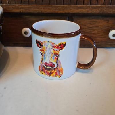 Large unmarked Gourmet Brown drip glaze mixing bowl with a variety of cute brown cows!