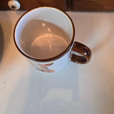 Large unmarked Gourmet Brown drip glaze mixing bowl with a variety of cute brown cows!