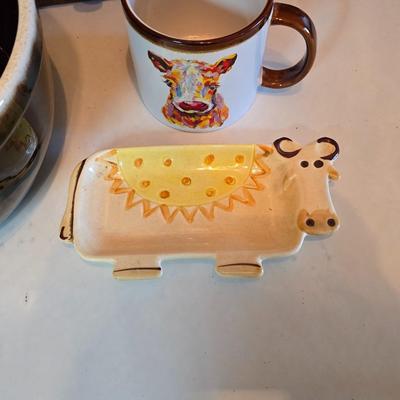 Large unmarked Gourmet Brown drip glaze mixing bowl with a variety of cute brown cows!