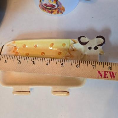 Large unmarked Gourmet Brown drip glaze mixing bowl with a variety of cute brown cows!