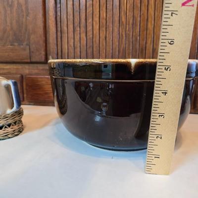 Large unmarked Gourmet Brown drip glaze mixing bowl with a variety of cute brown cows!