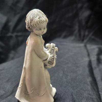 Three vintage Fontanini angel musician figurines, marked "Depose Italy" with a spider mark