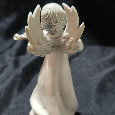 Three vintage Fontanini angel musician figurines, marked "Depose Italy" with a spider mark