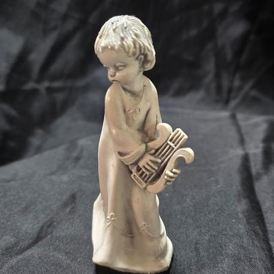 Three vintage Fontanini angel musician figurines, marked "Depose Italy" with a spider mark