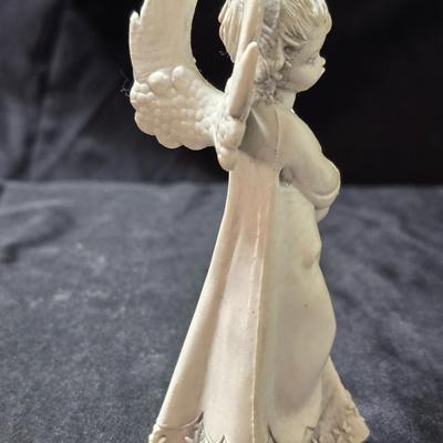 Three vintage Fontanini angel musician figurines, marked "Depose Italy" with a spider mark