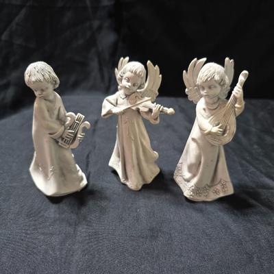 Three vintage Fontanini angel musician figurines, marked "Depose Italy" with a spider mark