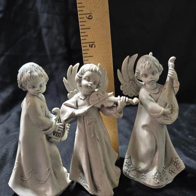 Three vintage Fontanini angel musician figurines, marked "Depose Italy" with a spider mark