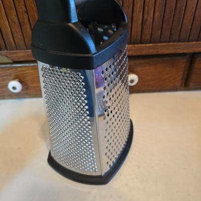 Kitchen gadgets - cutters, slicers and dicers with a strainer and a chrome flour sifter