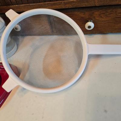 Kitchen gadgets - cutters, slicers and dicers with a strainer and a chrome flour sifter