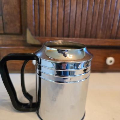 Kitchen gadgets - cutters, slicers and dicers with a strainer and a chrome flour sifter