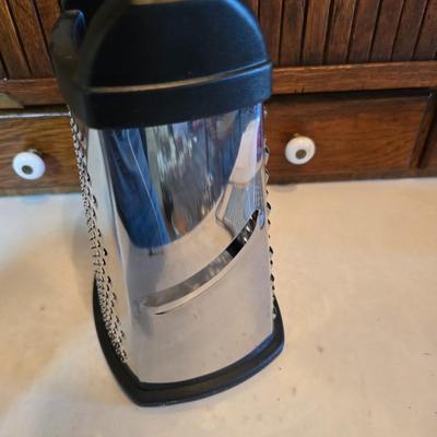 Kitchen gadgets - cutters, slicers and dicers with a strainer and a chrome flour sifter