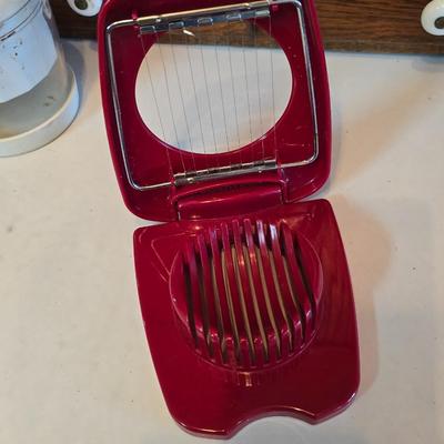 Kitchen gadgets - cutters, slicers and dicers with a strainer and a chrome flour sifter