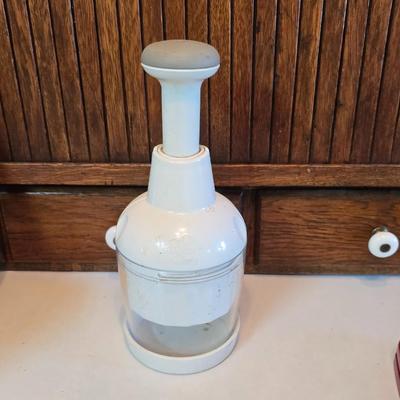 Kitchen gadgets - cutters, slicers and dicers with a strainer and a chrome flour sifter