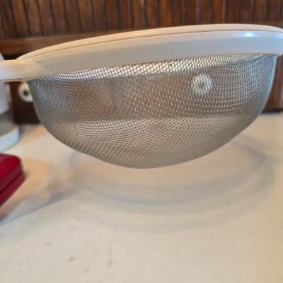 Kitchen gadgets - cutters, slicers and dicers with a strainer and a chrome flour sifter