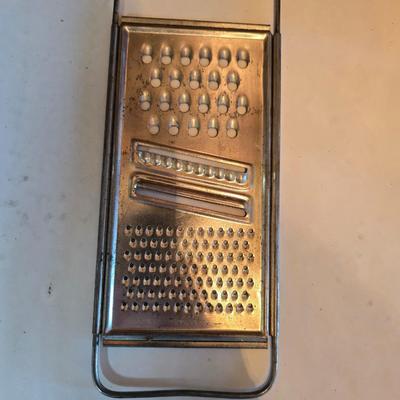 Kitchen gadgets - cutters, slicers and dicers with a strainer and a chrome flour sifter