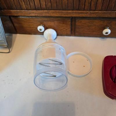 Kitchen gadgets - cutters, slicers and dicers with a strainer and a chrome flour sifter