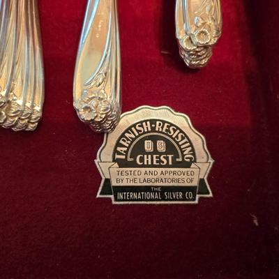 1847 Rogers Bros. "Daffodil" pattern silver-plate flatware set in a wooden chest.