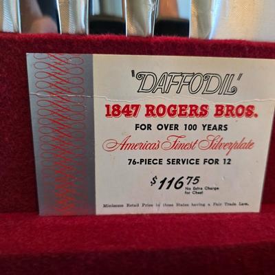 1847 Rogers Bros. "Daffodil" pattern silver-plate flatware set in a wooden chest.