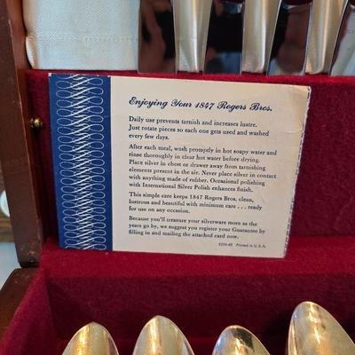 1847 Rogers Bros. "Daffodil" pattern silver-plate flatware set in a wooden chest.