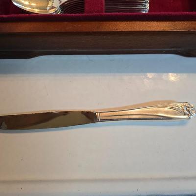 1847 Rogers Bros. "Daffodil" pattern silver-plate flatware set in a wooden chest.