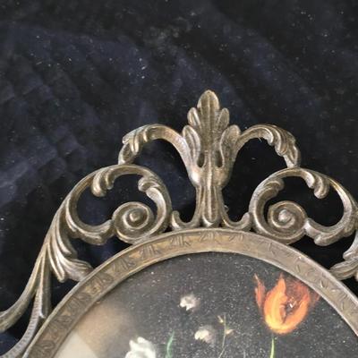 pair of vintage Italian floral still life prints in ornate brass-toned metal frames with convex, or bubble, glass.