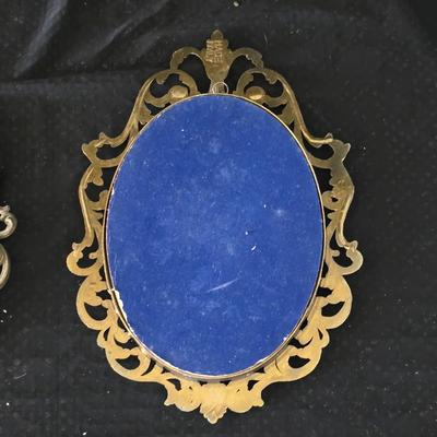 pair of vintage Italian floral still life prints in ornate brass-toned metal frames with convex, or bubble, glass.