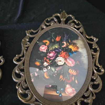pair of vintage Italian floral still life prints in ornate brass-toned metal frames with convex, or bubble, glass.