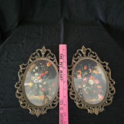 pair of vintage Italian floral still life prints in ornate brass-toned metal frames with convex, or bubble, glass.