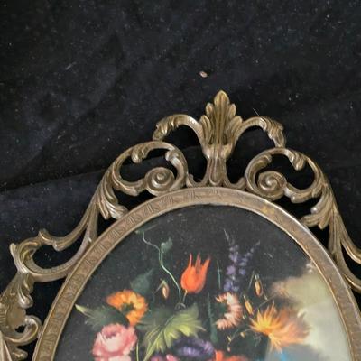 pair of vintage Italian floral still life prints in ornate brass-toned metal frames with convex, or bubble, glass.
