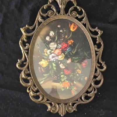 pair of vintage Italian floral still life prints in ornate brass-toned metal frames with convex, or bubble, glass.