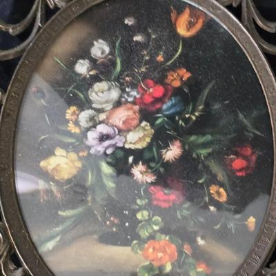pair of vintage Italian floral still life prints in ornate brass-toned metal frames with convex, or bubble, glass.