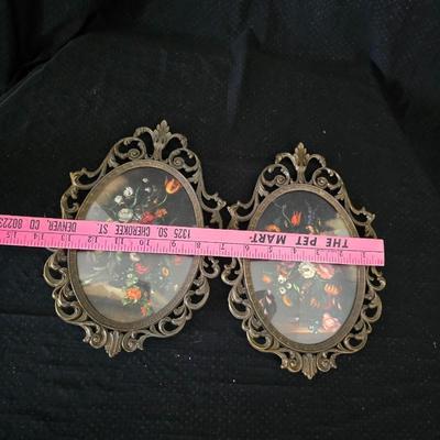 pair of vintage Italian floral still life prints in ornate brass-toned metal frames with convex, or bubble, glass.