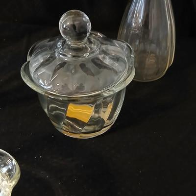 Glassware- two heavy glass lidded dishes, a Cruet with stopper, a bowl and a vase