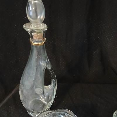 Glassware- two heavy glass lidded dishes, a Cruet with stopper, a bowl and a vase