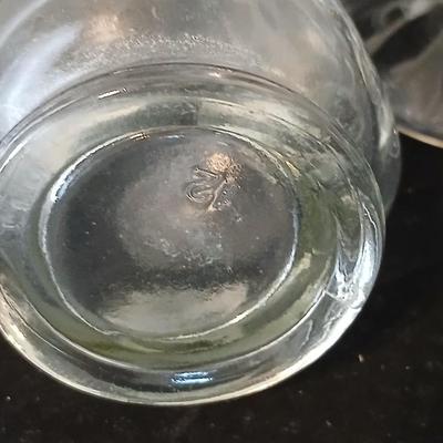 Glassware- two heavy glass lidded dishes, a Cruet with stopper, a bowl and a vase