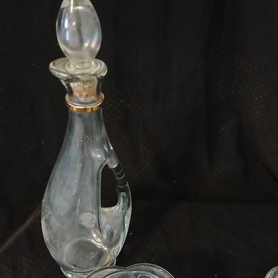 Glassware- two heavy glass lidded dishes, a Cruet with stopper, a bowl and a vase