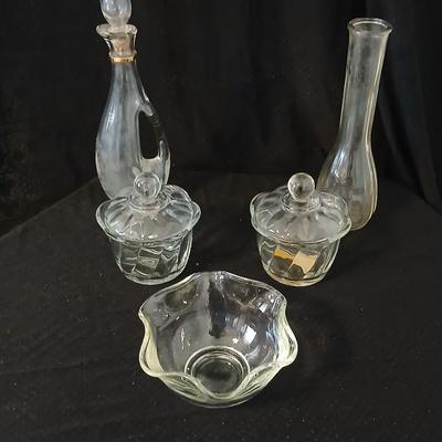 Glassware- two heavy glass lidded dishes, a Cruet with stopper, a bowl and a vase