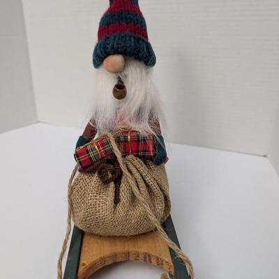 The Gnommery Christmas Gnome On Wooden Sled With Pipe And Gift Sack