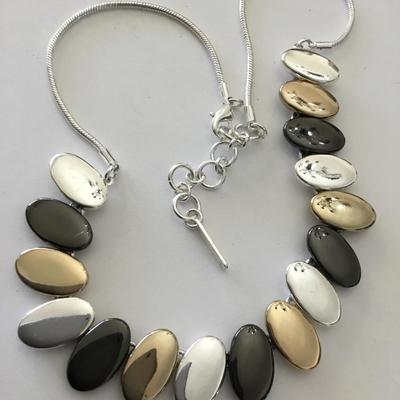 Very nice silver gold toned, nine West necklace