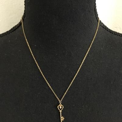 Vintage 1928 gold tone, skeleton heart key pendant, very dainty