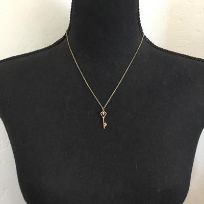 Vintage 1928 gold tone, skeleton heart key pendant, very dainty