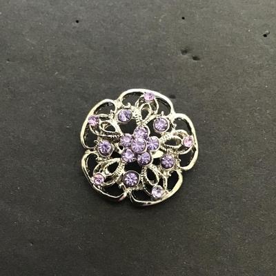 Silvertone brooch with light, purple rhinestones